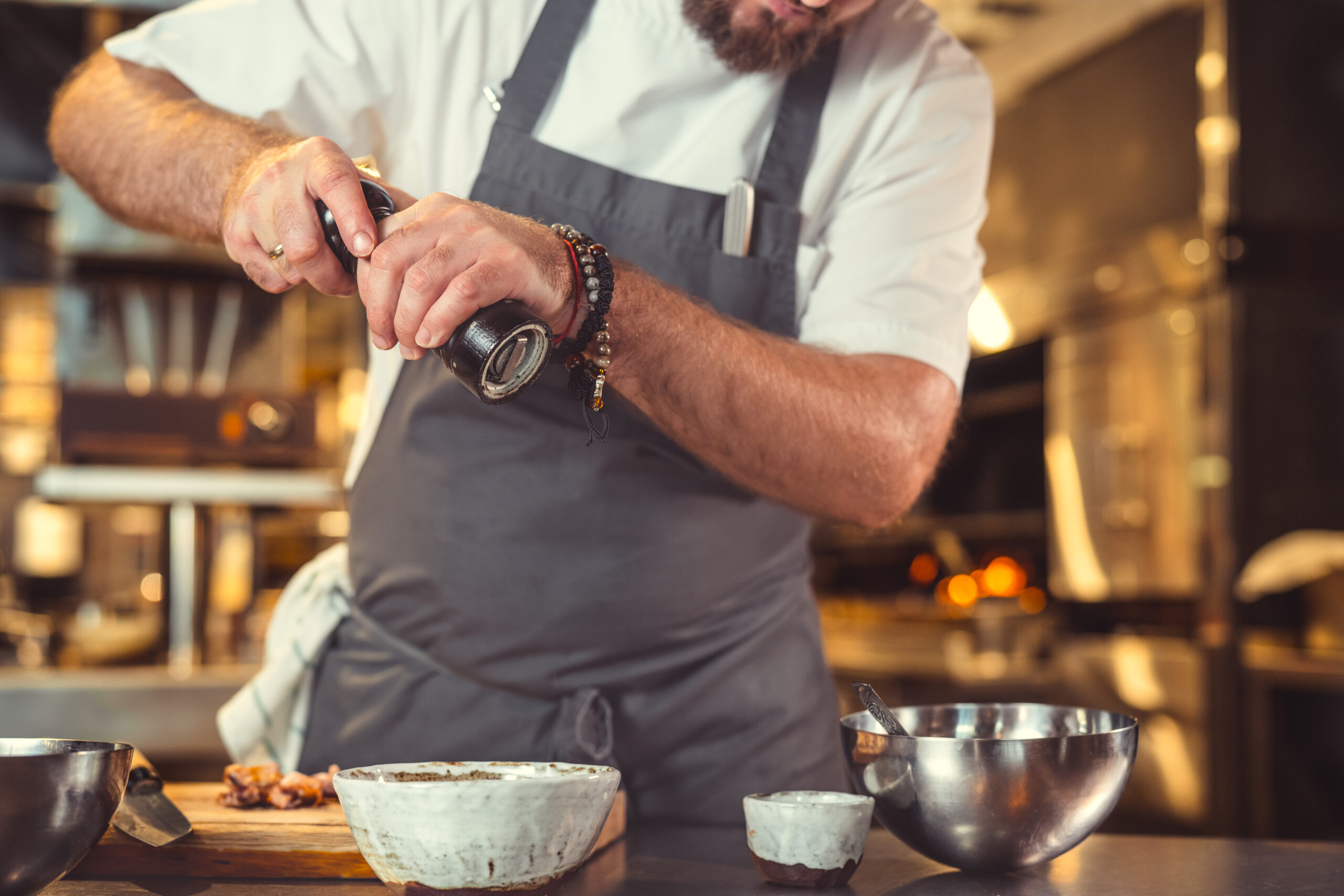 Chef in uniform cooking indoors